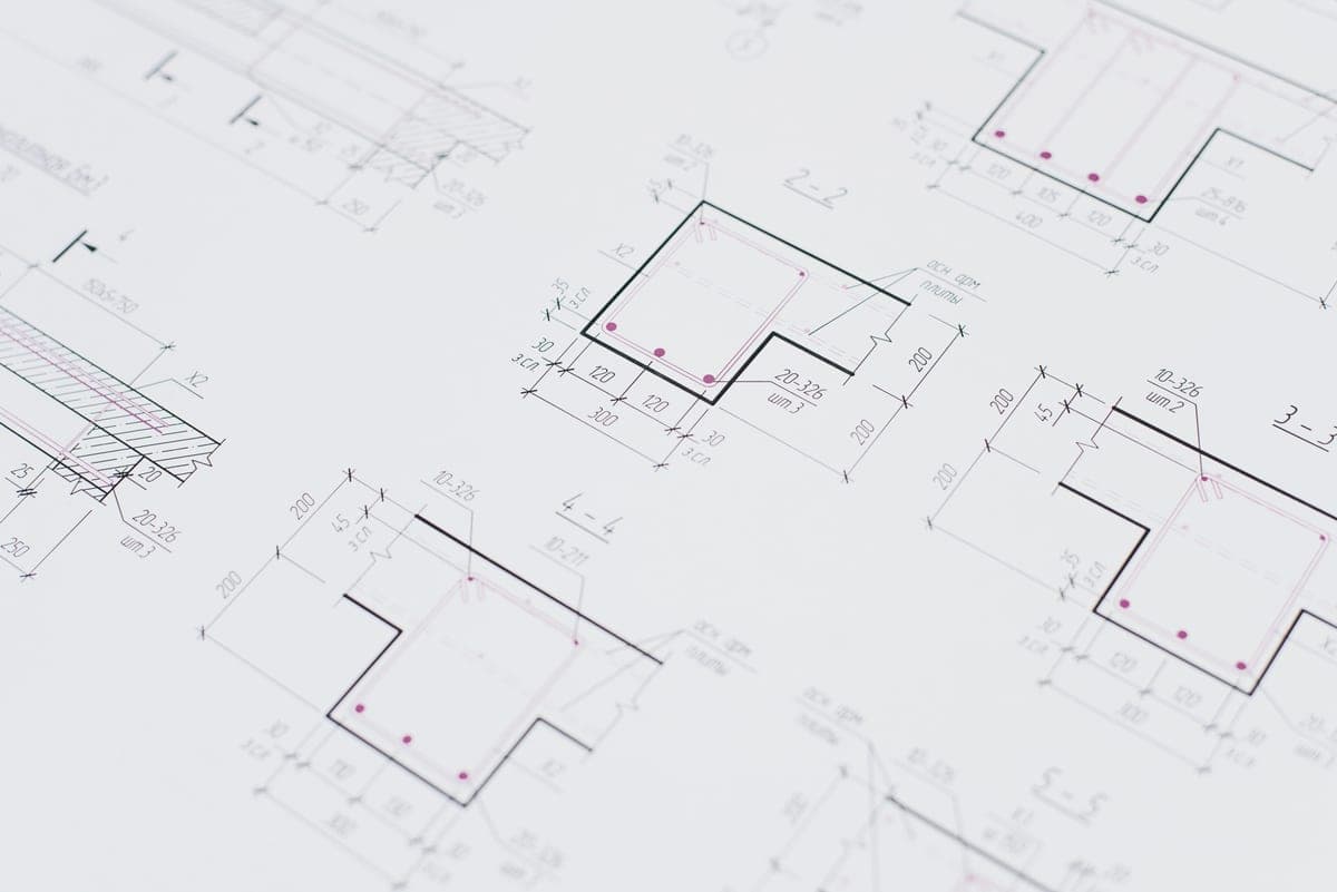 Technical drawings laid out on a desk